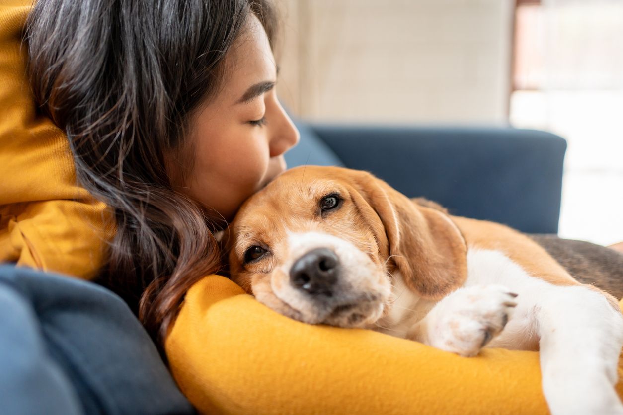 Woman holding dog